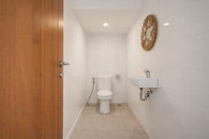 Bathroom in modern tropical villa, Nusa Dua, Bali, featuring minimalist design and clean white tiles.