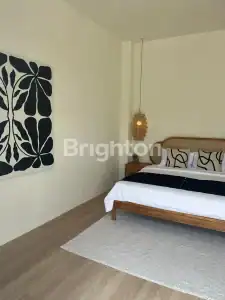 Elegant bedroom with modern decor and minimalist design.