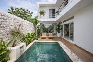 Modern tropical villa in Nusa Dua featuring a private pool and lush garden. Perfect for luxury vacat.