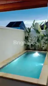 Private pool at twin villa in Tabanan with scenic sky view.